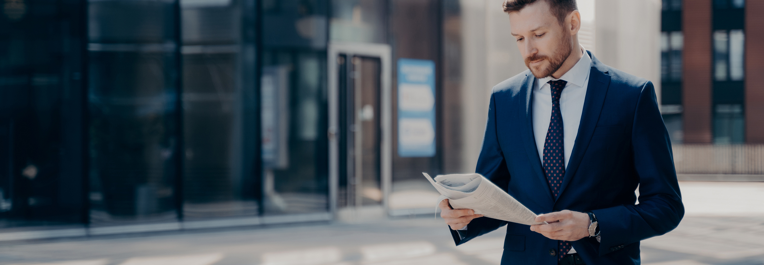 Focused Bearded Young Businessman In Formal Outfit Walking Alone