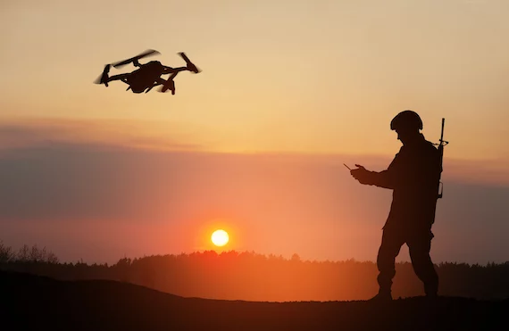 Silhouette Of Soldier Are Using Drone And Laptop Computer For Scouting During Military Operation Aga