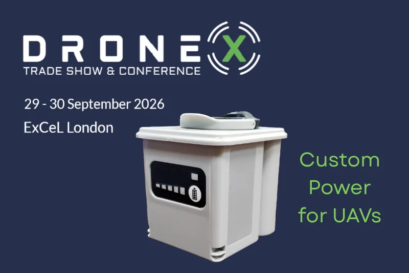 Event logo and dates next to a battery pack