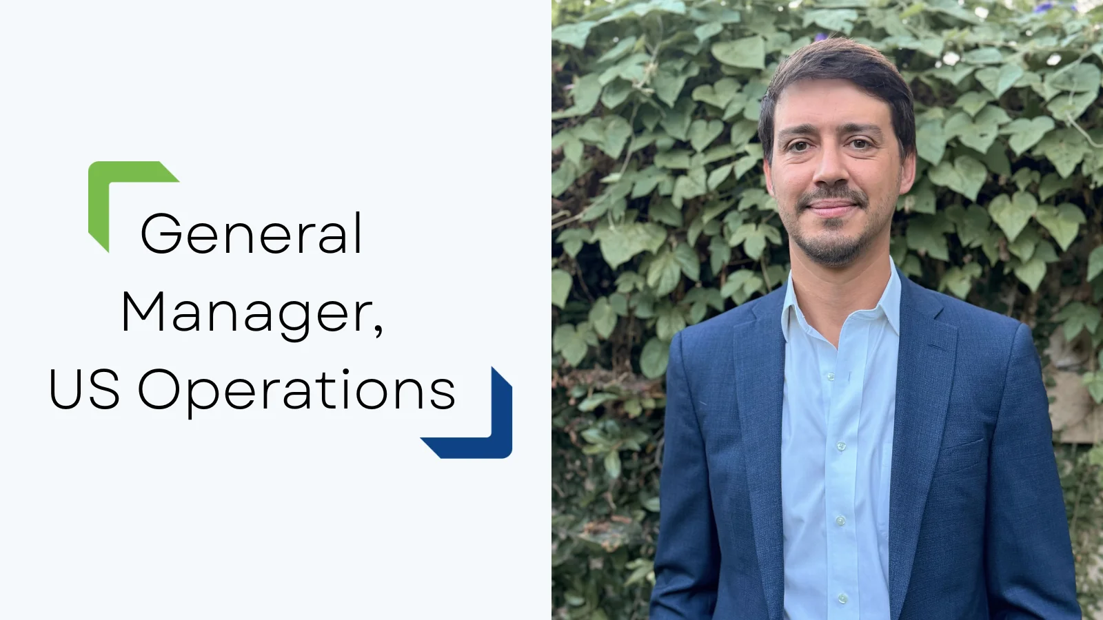 Custom Power General Manager standing in front of greenery